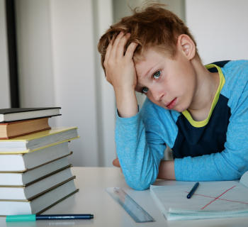 boy overwhelmed by homework
